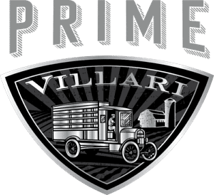 A black and white shield-shaped logo with PRIME above and VILLARI across the top. Below, an old-fashioned truck drives beside a barn and silo with rays in the background—evoking a tradition of fresh cuts from a classic butcher counter.