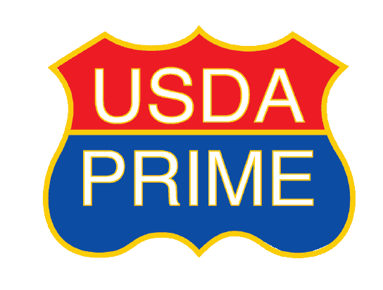 A badge-shaped sign with a red top and blue bottom that reads USDA PRIME in bold yellow letters, outlined in white—perfect for highlighting premium meat selection at the butcher counter.